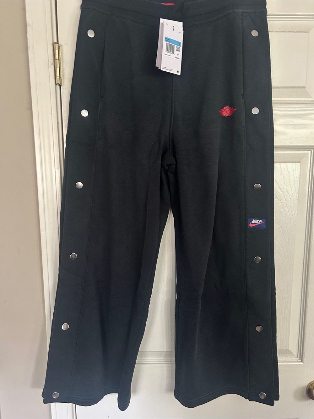 Nike Adult Black Sweatpants with Red Accent and Silver Snaps